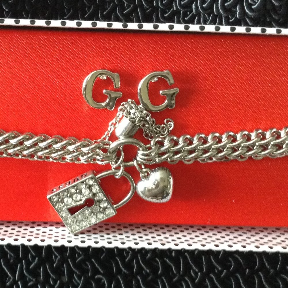 Guess charm bracelet and earring set